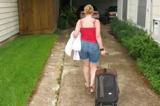 Image of Lady departing with her Essential Things to Pack for Travelling